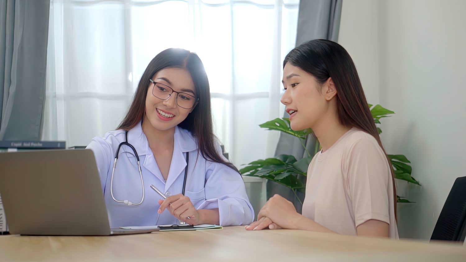 Doctor discussing a treatment plan with a patient during a consultation