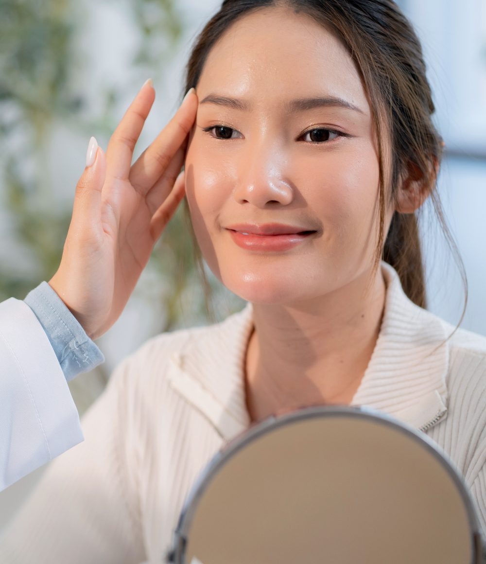 Aesthetic doctor assessing a patient's skin during an RF lifting consultation
